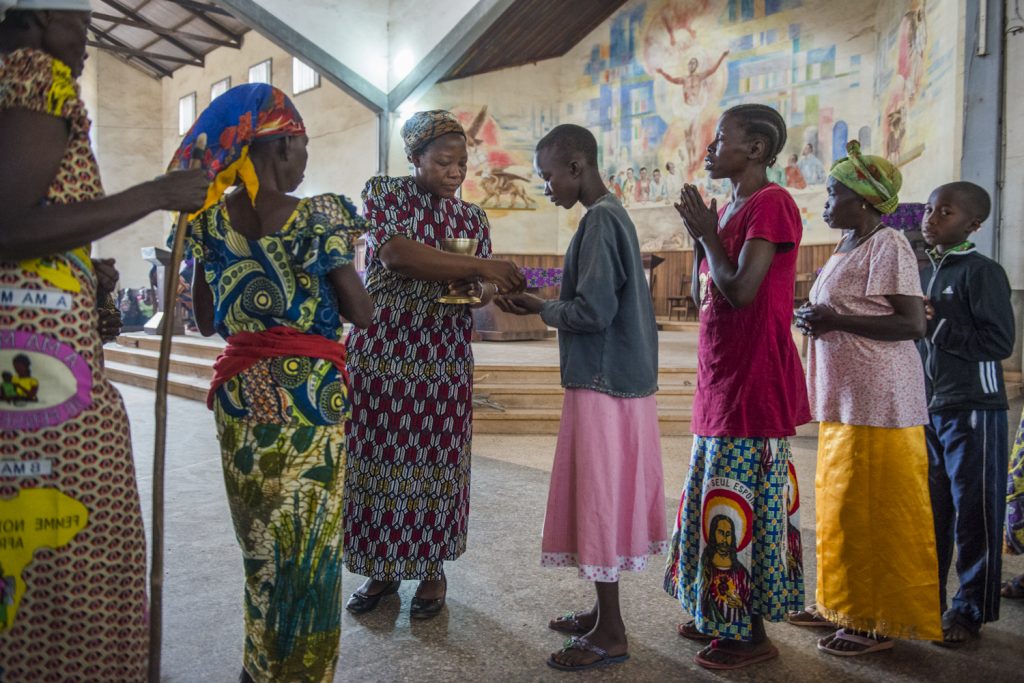 Sister Angelique, winner of the Nansen Award in 2013 for her work with 2,000 women and girls who were victims of LRA, giving communion at the Sunday mass in Dungu Cathedral.