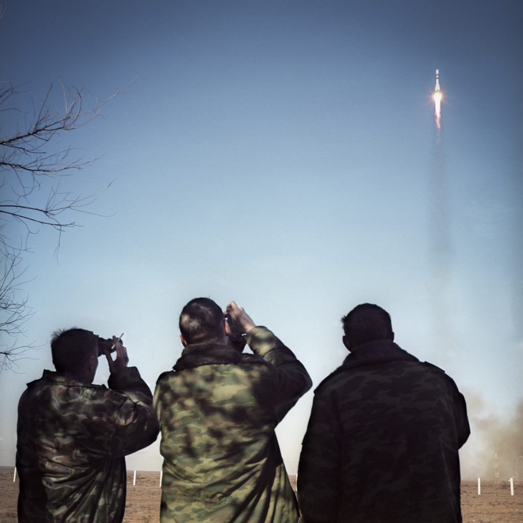 Russian soldiers watching a rocket launch at the Baikonur cosmodrome, in western Kazkhstan. Baikonur is the last polygon of Kazakhstan still used by the russian army.